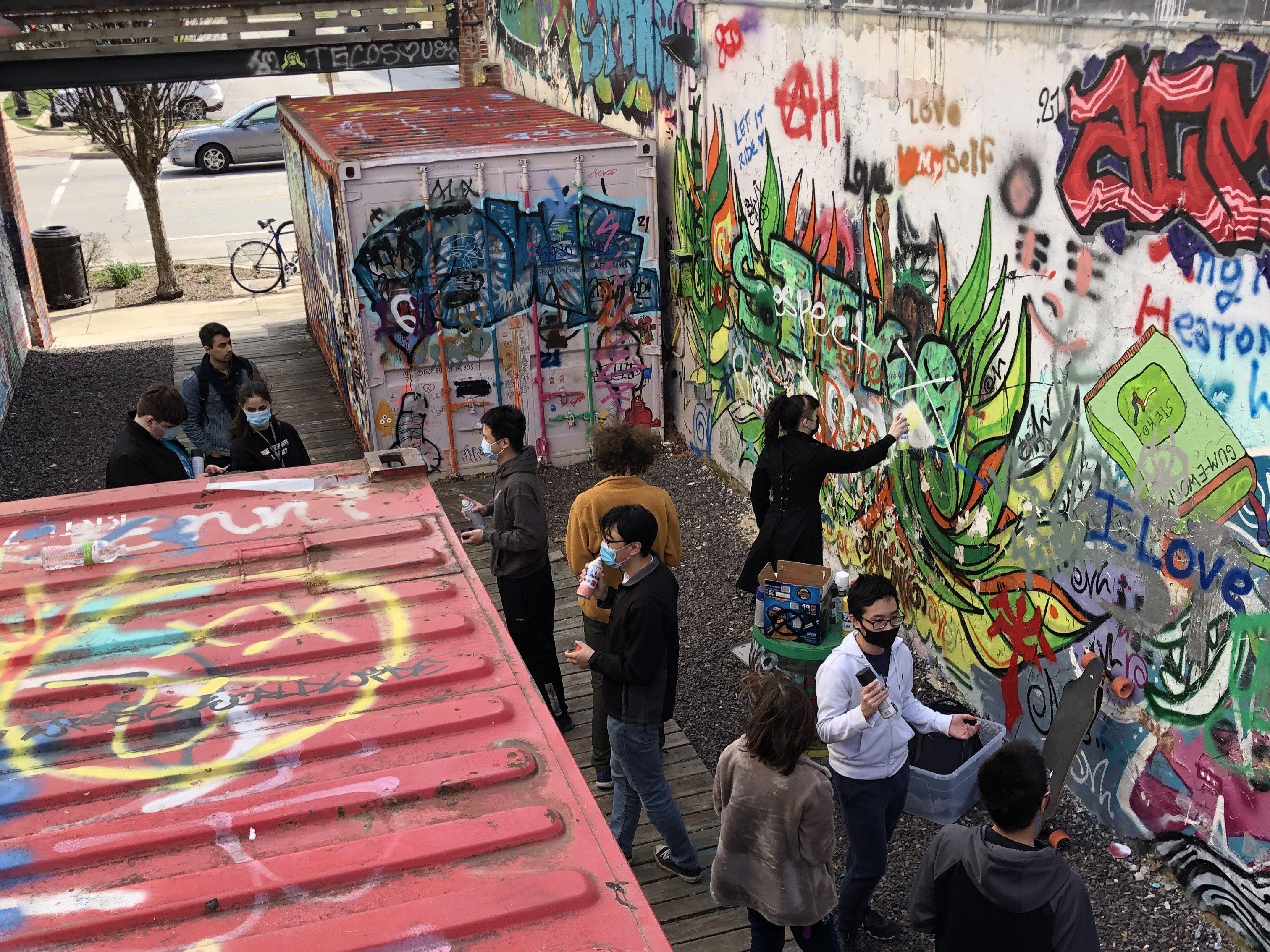 An aerial shot of SIGPwny members spray painting art